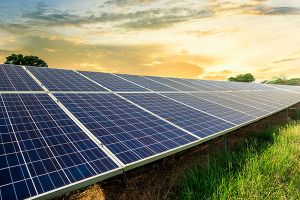 A stock photo of solar panels in a field.