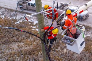 Line workers in a bucket truck.